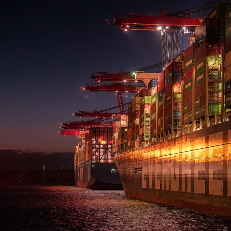 shipping port cranes sunset